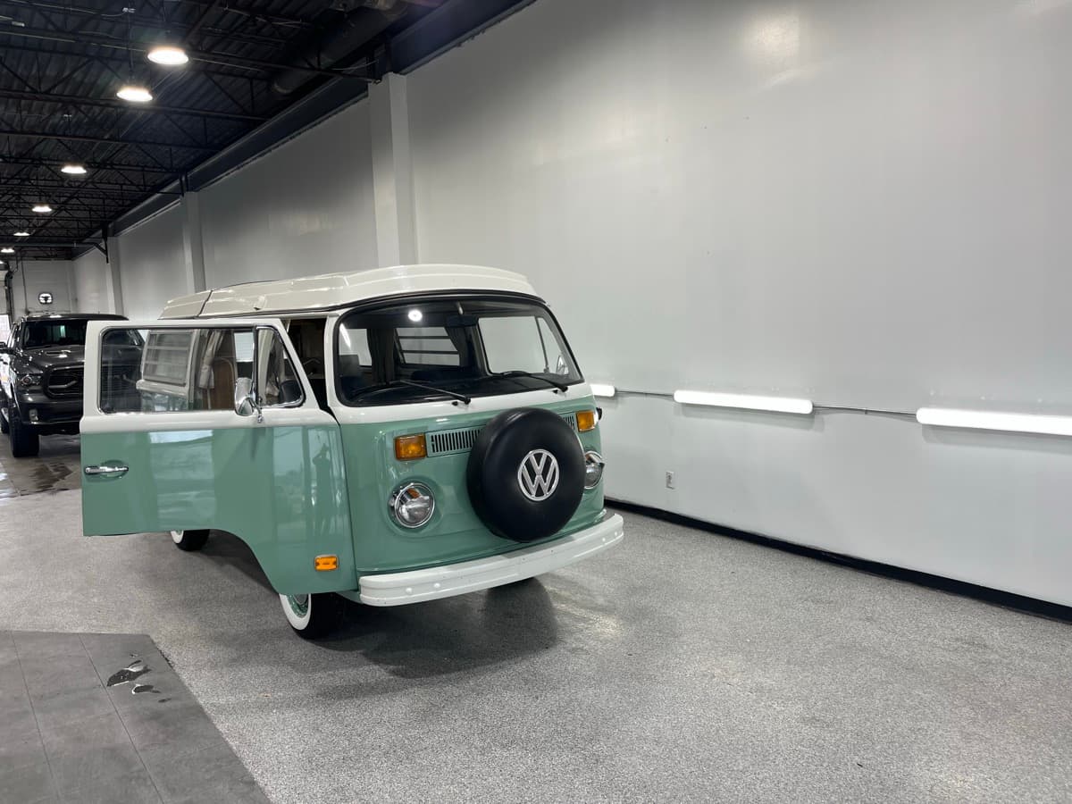 Close-up of precision hand detailing on vehicle trim and panels