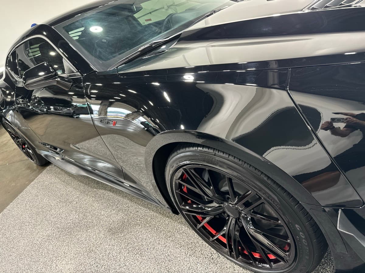 Attention to detail on vehicle door jamb and trim during premium detail service