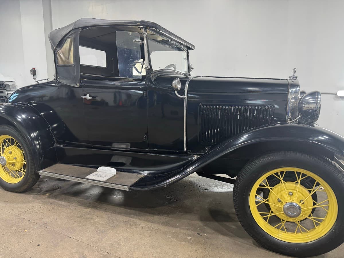Vintage 1930s black truck with yellow spoke wheels fully detailed and restored finish