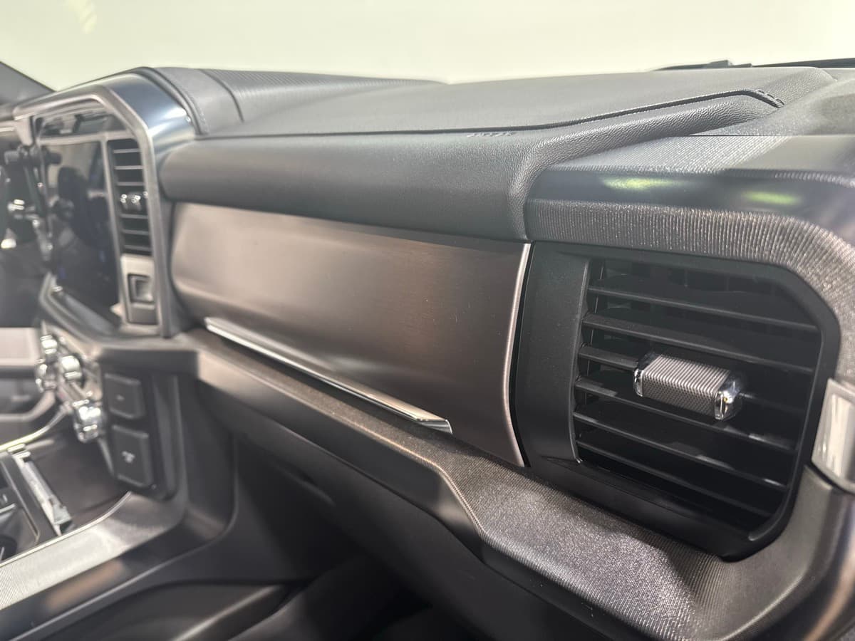Dashboard and steering wheel detail showing clean air vents and conditioned surfaces