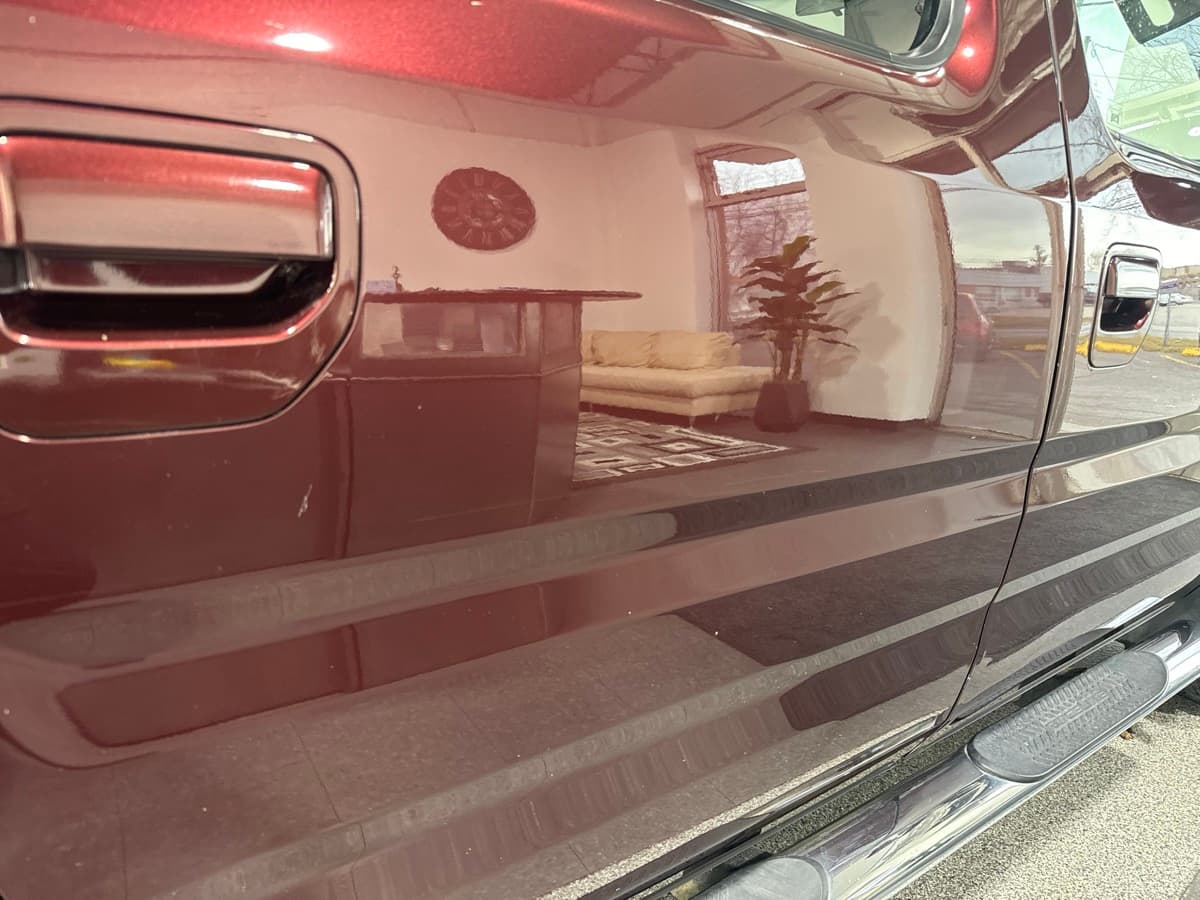 Swirl removal and machine polishing during professional paint correction service